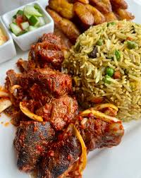 Ghana Coconut Rice, salad, plantain, and Goatmeat